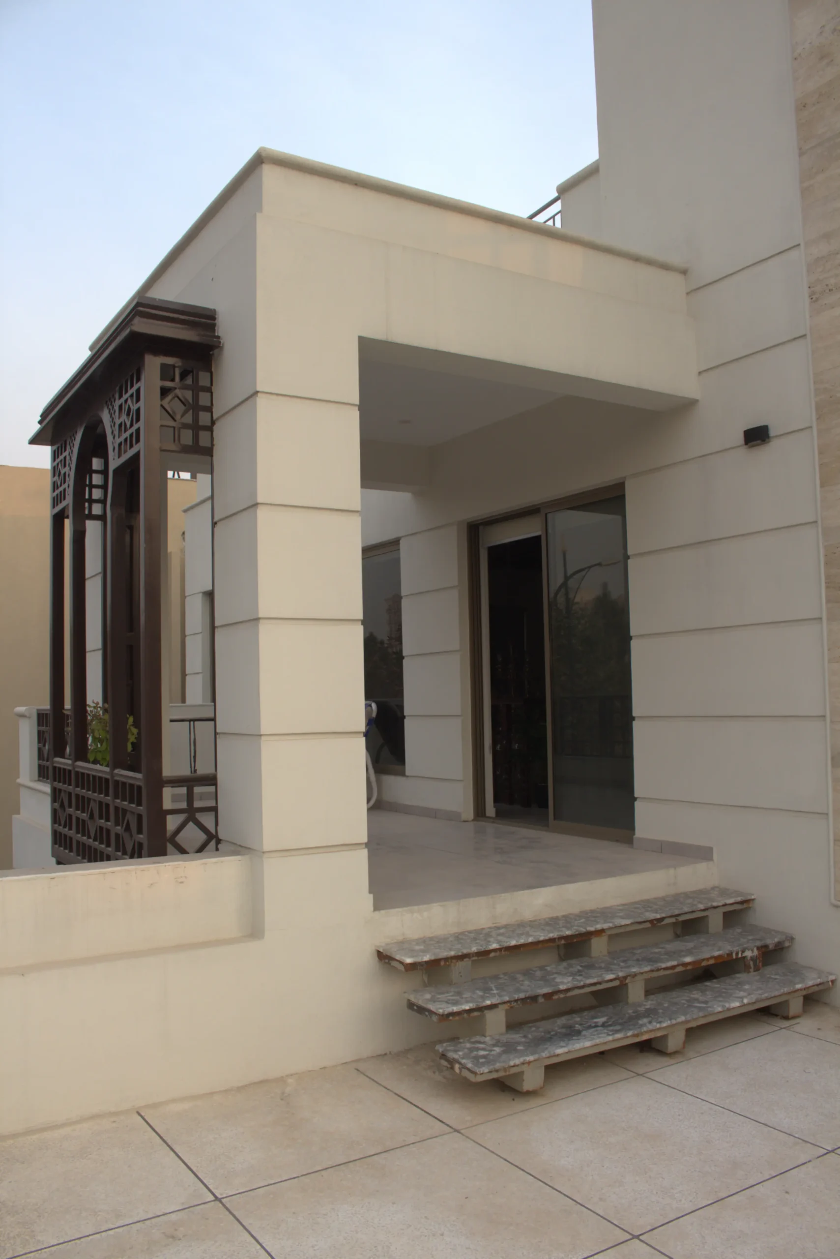 Modern house entrance with covered porch